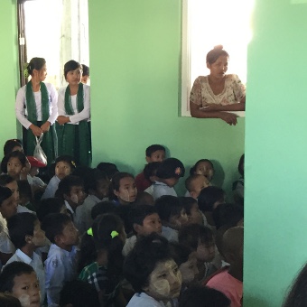 Children's eyes glued onto the stage. 